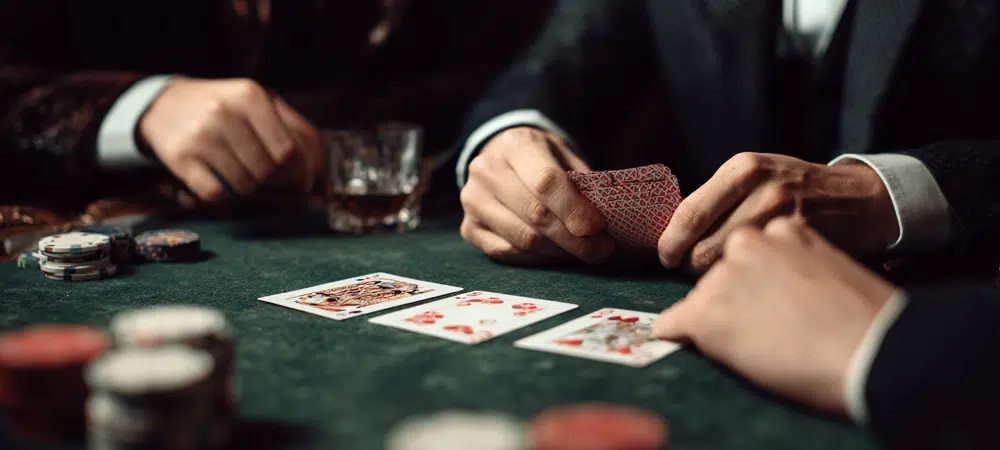 people playing three card poker